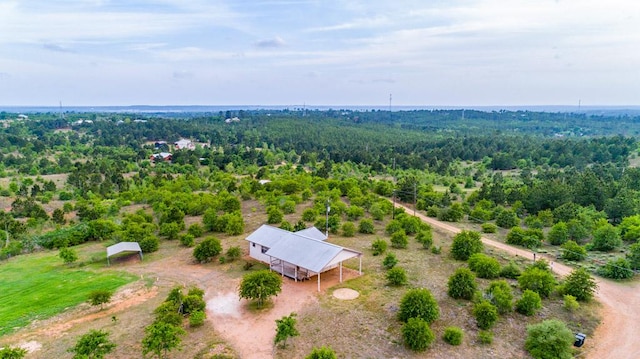 bird's eye view featuring a forest view
