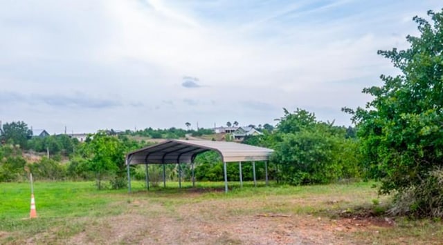 121 Hudson Rd, Smithville, TX 78957 - view of yard with a detached carport and driveway