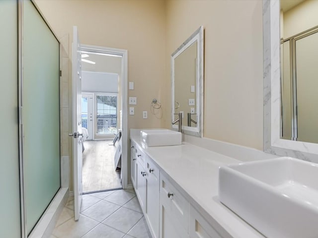 2918 Ranch Road 620 N Unit X-205, Austin, TX 78734 - bathroom featuring double vanity, a shower stall, and tile patterned floors