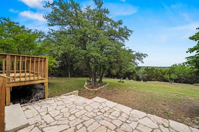 view of yard with a patio and a wooden deck