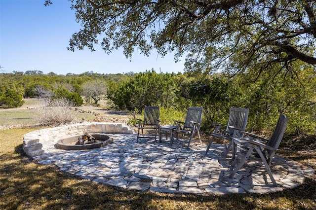 view of patio with a fire pit