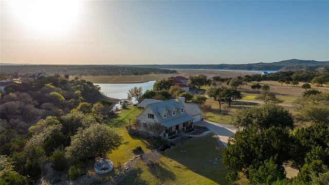 birds eye view of property featuring a rural view and a water view