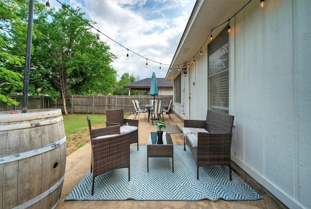 view of patio / terrace featuring an outdoor hangout area, outdoor dining space, and a fenced backyard