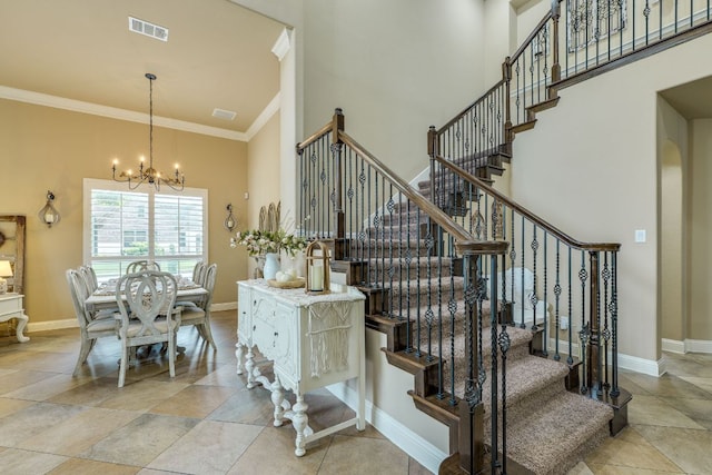 2600 Dalea St, Round Rock, TX 78681 - stairs with ornamental molding, an inviting chandelier, visible vents, and baseboards