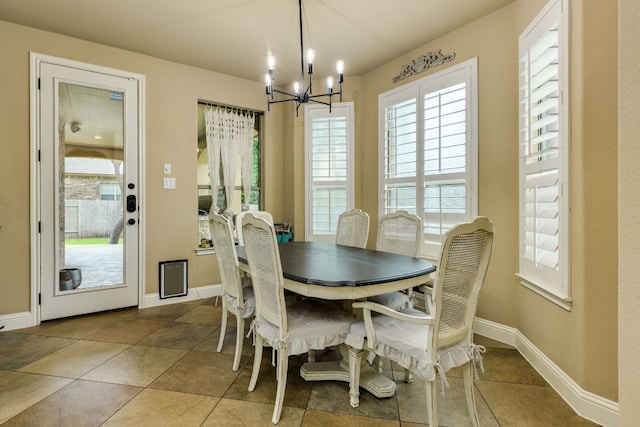 2600 Dalea St, Round Rock, TX 78681 - dining room featuring tile patterned flooring, a notable chandelier, and baseboards