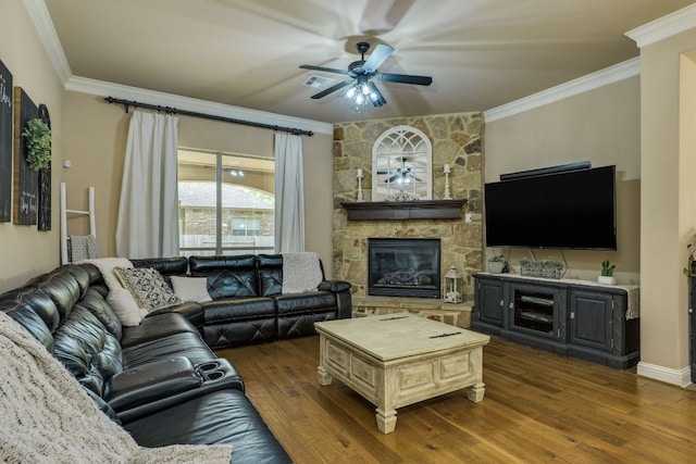2600 Dalea St, Round Rock, TX 78681 - living area featuring a fireplace, crown molding, a ceiling fan, visible vents, and wood finished floors