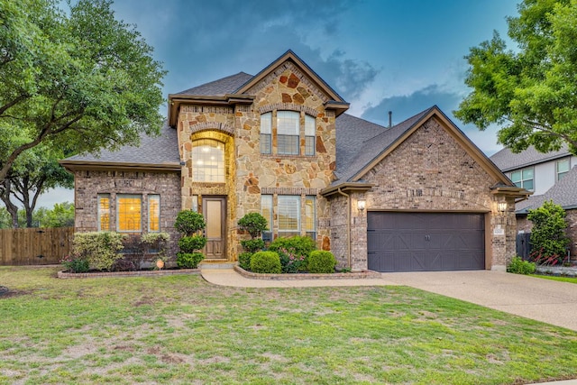 2600 Dalea St, Round Rock, TX 78681 - view of front of house featuring a front yard, driveway, a garage, and fence