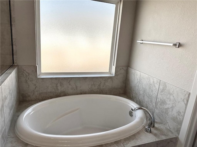 full bath with a garden tub