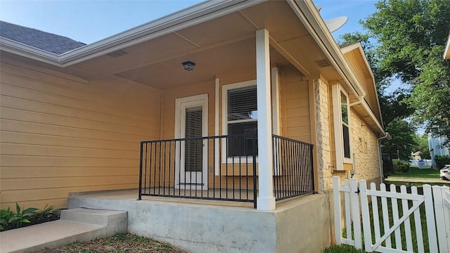 exterior space with stone siding and fence