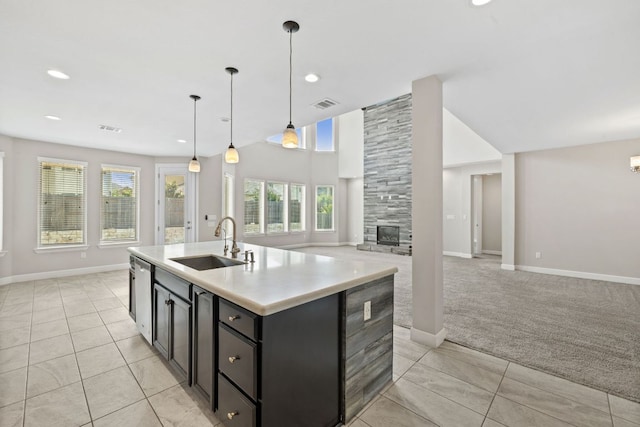 829 Expedition Way, Round Rock, TX 78665 - kitchen featuring open floor plan, dishwasher, light tile patterned flooring, light countertops, and recessed lighting