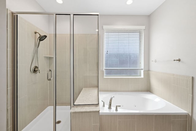 829 Expedition Way, Round Rock, TX 78665 - full bathroom with a stall shower, a whirlpool tub, and plenty of natural light