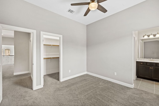 829 Expedition Way, Round Rock, TX 78665 - unfurnished bedroom with light carpet, a spacious closet, a closet, and ensuite bath