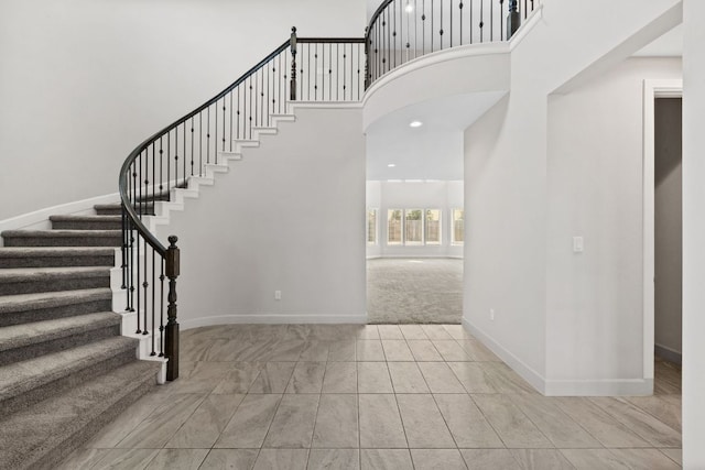 829 Expedition Way, Round Rock, TX 78665 - staircase with a high ceiling and carpet floors