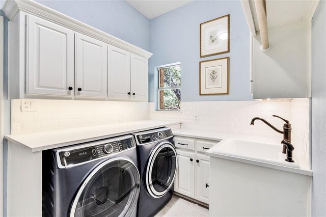 93 Duck Lake Dr, Lakeway, TX 78734 - washroom with cabinet space, washing machine and dryer, and light tile patterned flooring