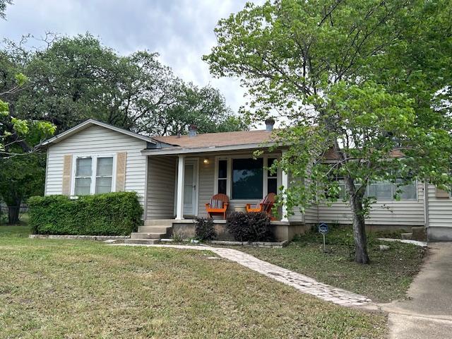 11600 Hornsby St, Austin, TX 78753 - view of front of home featuring covered porch and a front yard