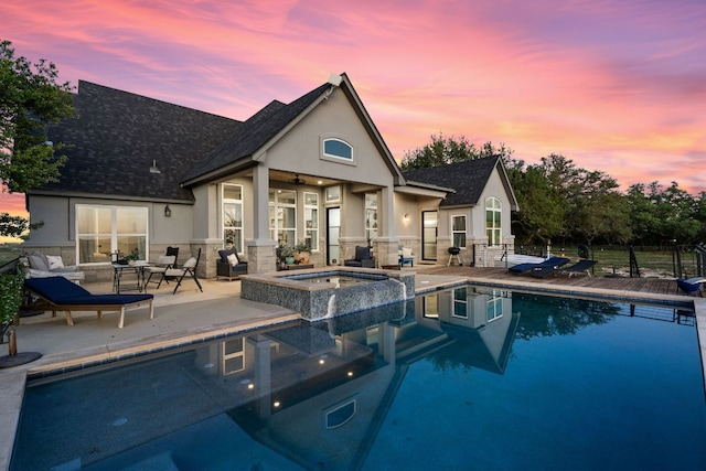 101 Durango Dr, Johnson City, TX 78636 - view of pool featuring a ceiling fan, fence, a pool with connected hot tub, and a patio area