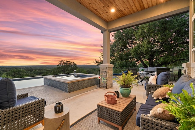101 Durango Dr, Johnson City, TX 78636 - view of patio with an outdoor hot tub
