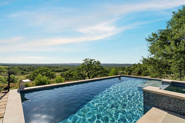 101 Durango Dr, Johnson City, TX 78636 - view of swimming pool with a wooded view