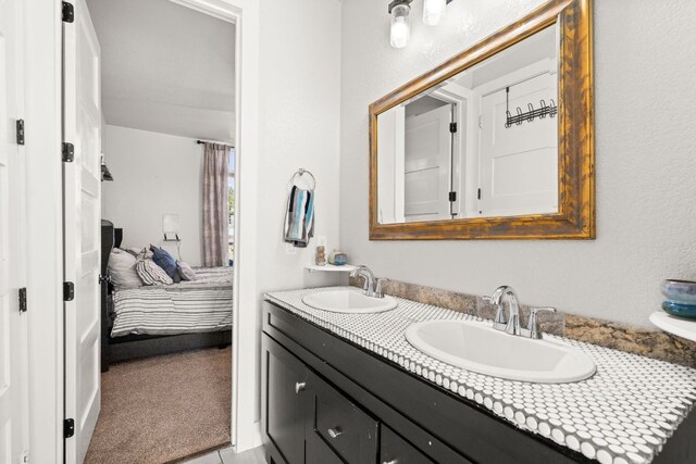 101 Durango Dr, Johnson City, TX 78636 - ensuite bathroom with double vanity, a sink, and connected bathroom