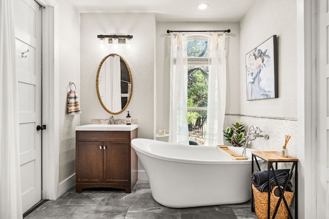 101 Durango Dr, Johnson City, TX 78636 - full bath with recessed lighting, a soaking tub, and vanity