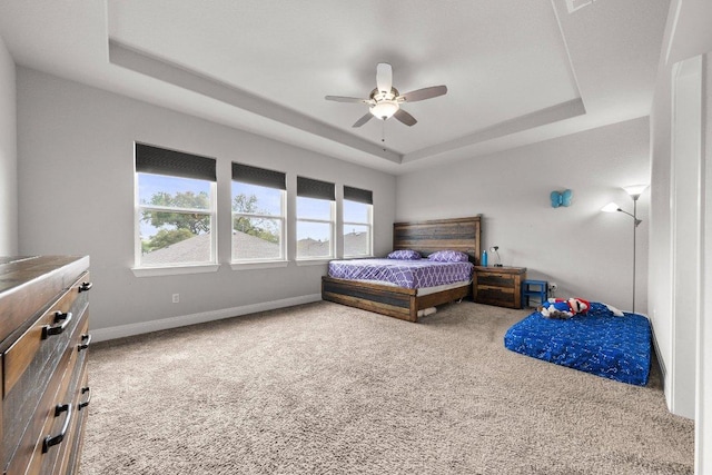 3750 E Palm Valley Blvd Unit 98, Round Rock, TX 78665 - bedroom featuring baseboards, a raised ceiling, a ceiling fan, and carpet floors