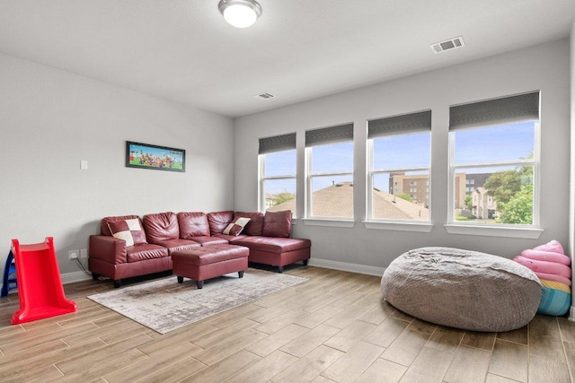 3750 E Palm Valley Blvd Unit 98, Round Rock, TX 78665 - living area with visible vents and light wood-style floors