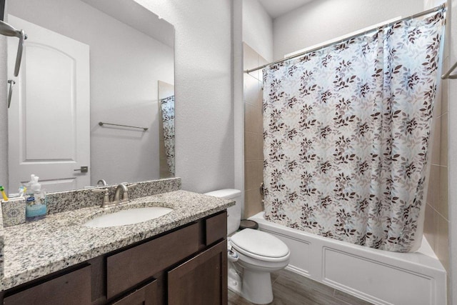 3750 E Palm Valley Blvd Unit 98, Round Rock, TX 78665 - bathroom with shower / bath combo with shower curtain, toilet, wood finished floors, and vanity