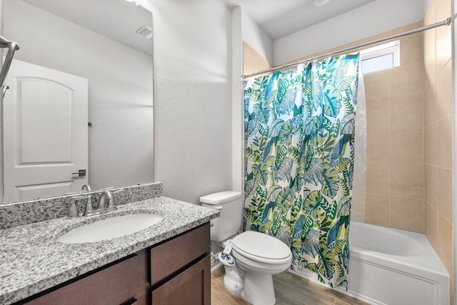 3750 E Palm Valley Blvd Unit 98, Round Rock, TX 78665 - bathroom featuring toilet, vanity, shower / bath combo, and wood finished floors