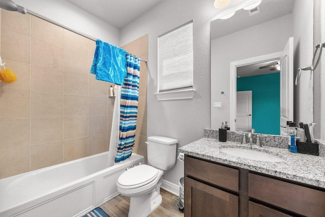 3750 E Palm Valley Blvd Unit 98, Round Rock, TX 78665 - bathroom with wood finished floors, shower / bathtub combination with curtain, toilet, vanity, and visible vents