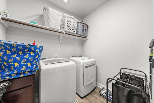 3750 E Palm Valley Blvd Unit 98, Round Rock, TX 78665 - laundry room with separate washer and dryer, light wood-style flooring, laundry area, and baseboards