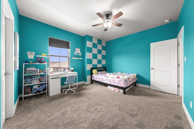 3750 E Palm Valley Blvd Unit 98, Round Rock, TX 78665 - bedroom featuring baseboards, a ceiling fan, and carpet floors