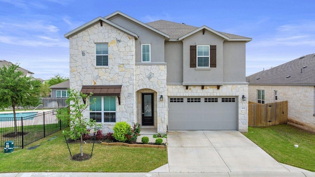 3750 E Palm Valley Blvd Unit 98, Round Rock, TX 78665 - traditional home with fence, a front yard, an attached garage, and stone siding