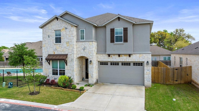 3750 E Palm Valley Blvd Unit 98, Round Rock, TX 78665 - traditional-style house featuring fence, a garage, concrete driveway, and stone siding