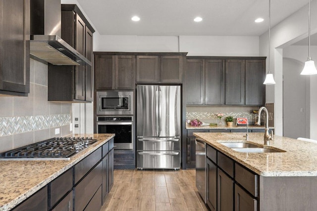 3750 E Palm Valley Blvd Unit 98, Round Rock, TX 78665 - kitchen featuring a sink, dark brown cabinetry, wall chimney range hood, and stainless steel appliances