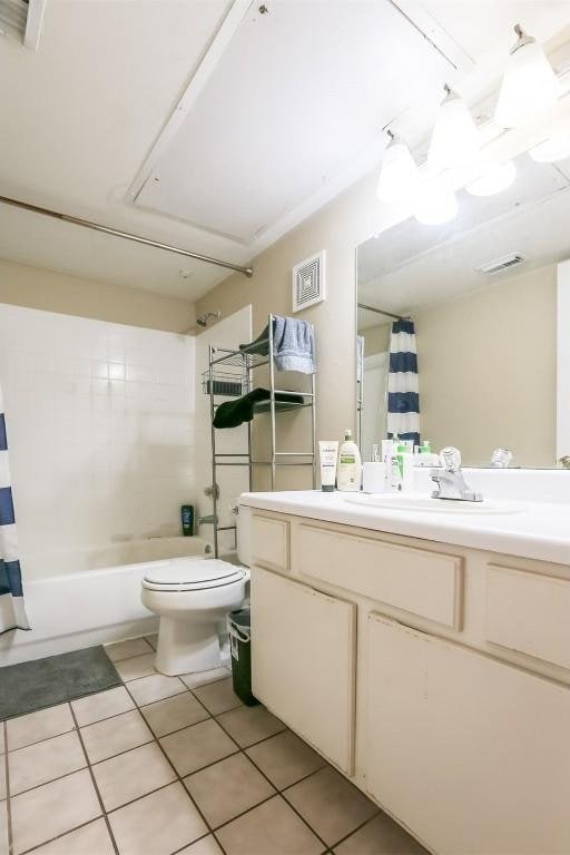 bathroom with visible vents, toilet, tile patterned flooring, and vanity