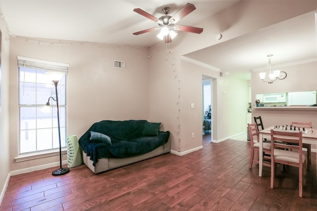 501 W 26th St Unit 312, Austin, TX 78705 - dining space featuring wood finished floors, a chandelier, healthy amount of natural light, a ceiling fan, and ornamental molding