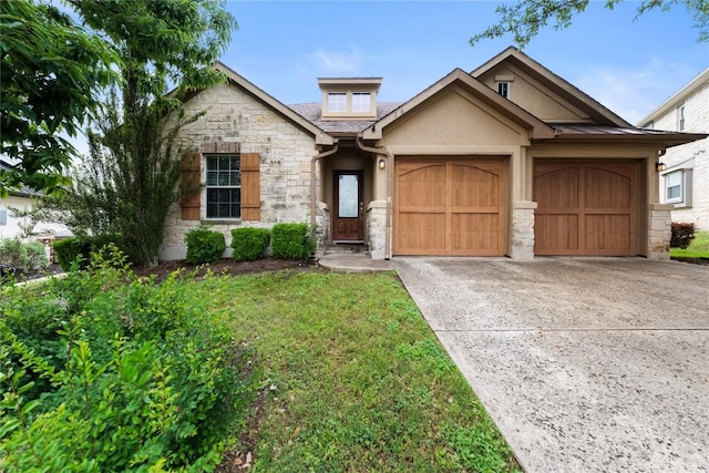 view of front of home with concrete driveway, stone siding, an attached garage, and stucco siding