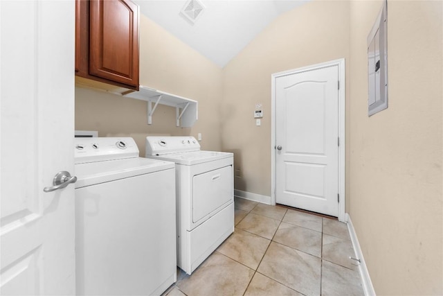 clothes washing area featuring visible vents, baseboards, light tile patterned flooring, washer and dryer, and cabinet space
