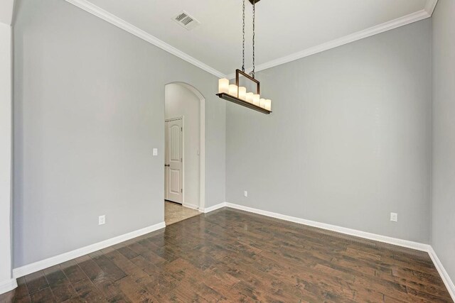 3909 Vinalopo Dr, Austin, TX 78738 - empty room featuring arched walkways, crown molding, baseboards, and dark wood finished floors