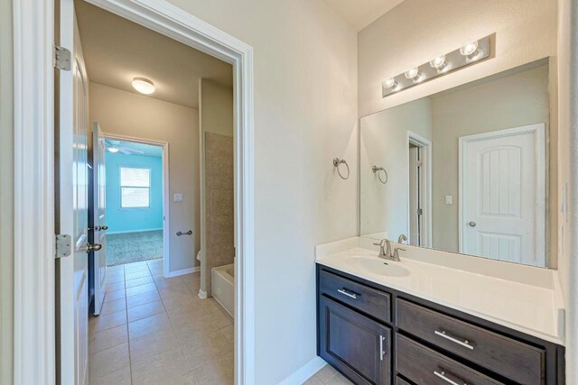 3909 Vinalopo Dr, Austin, TX 78738 - bathroom with vanity, tile patterned floors, and baseboards