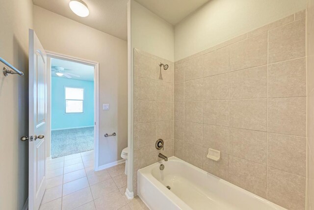 3909 Vinalopo Dr, Austin, TX 78738 - full bathroom featuring toilet, tile patterned flooring, shower / tub combination, and baseboards