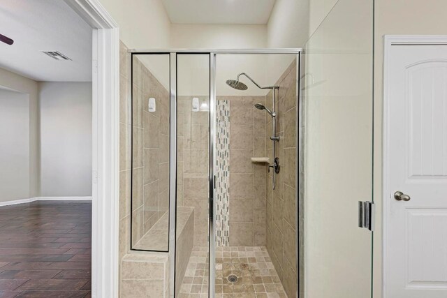 3909 Vinalopo Dr, Austin, TX 78738 - bathroom with a stall shower and baseboards