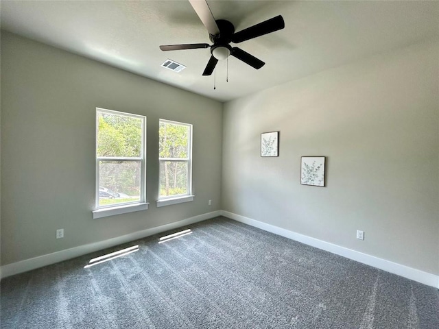 128 Heleakala Dr, Bastrop, TX 78602 - spare room with baseboards, a ceiling fan, carpet flooring, and visible vents