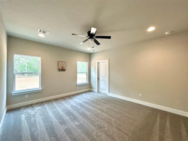 128 Heleakala Dr, Bastrop, TX 78602 - unfurnished room featuring carpet, a ceiling fan, baseboards, recessed lighting, and visible vents