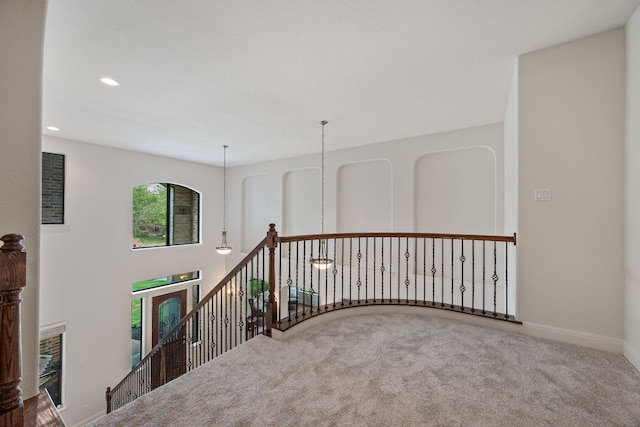 hallway featuring an upstairs landing, recessed lighting, carpet flooring, and baseboards