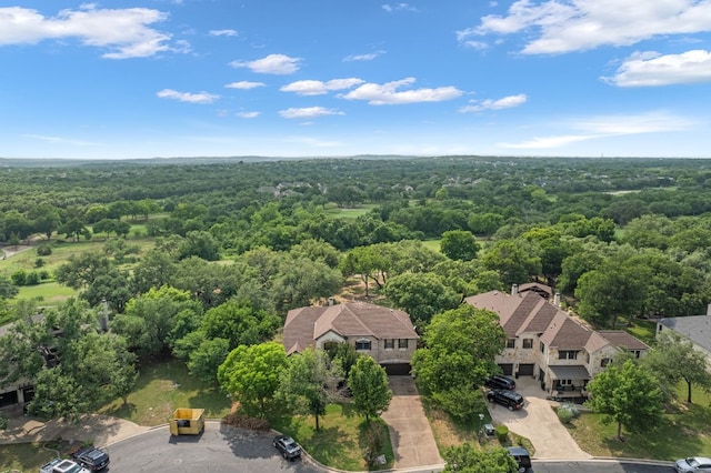 birds eye view of property with a wooded view