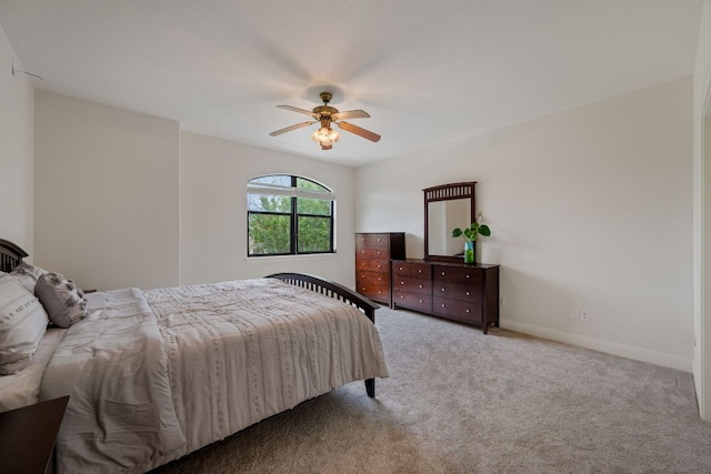 bedroom featuring a ceiling fan, carpet flooring, and baseboards