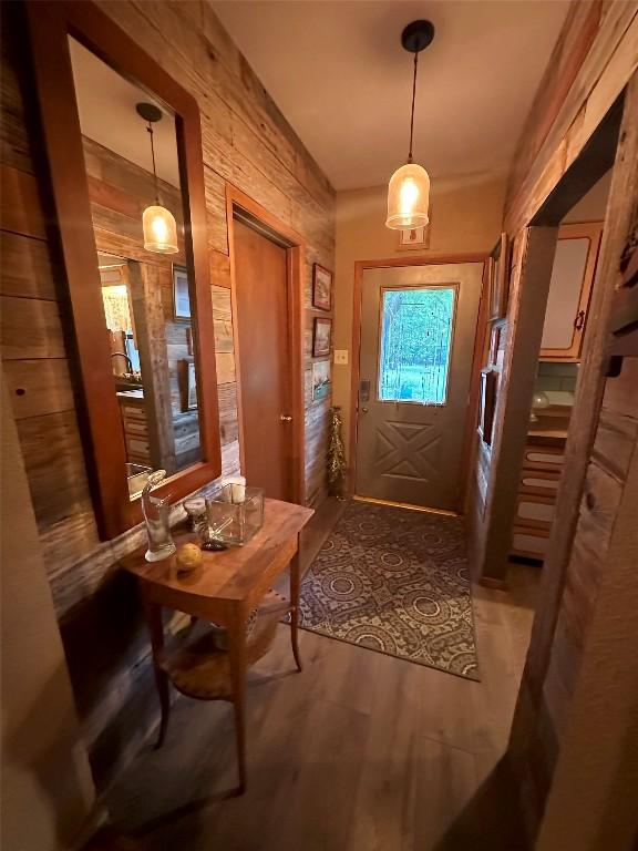 doorway to outside with wood finished floors