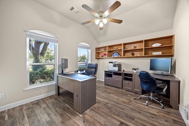 office with dark wood-style flooring, a ceiling fan, visible vents, vaulted ceiling, and baseboards