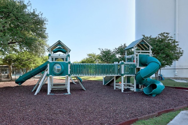 community jungle gym featuring fence